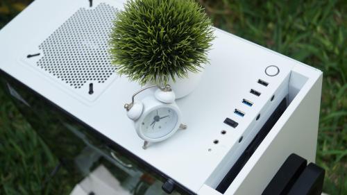 Whie PC and time clock in a garden
