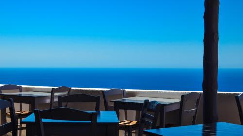 Anafi Island Greece Photo – Aegean Sea View from Taverna | Minimal Coastal Digital Wallpaper