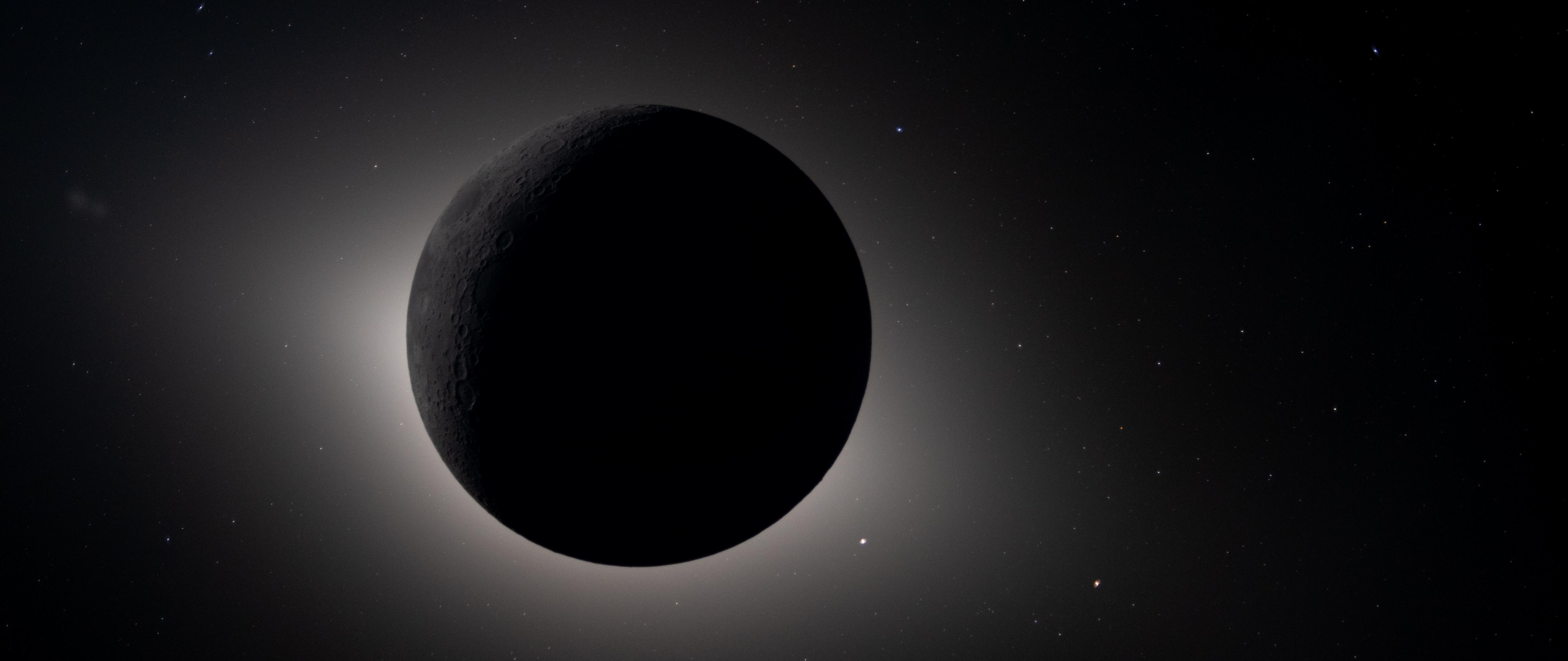 I edited the Artemis II Solar Eclipse photo into the perfect desktop wallpaper - OLED friendly!