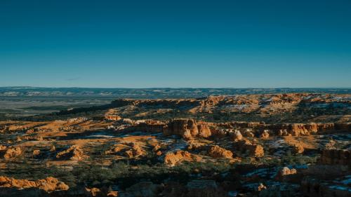 Bryce Canyon's iconic hoodoos dusted with snow under a crystal-clear winter sky — Utah, USA
