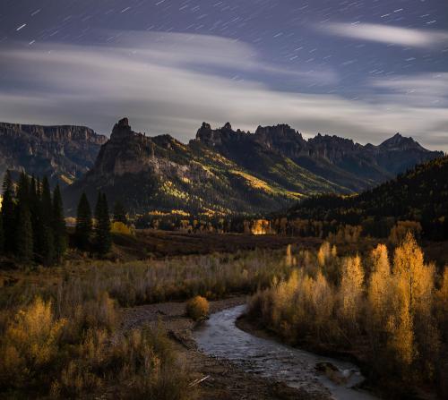 A long exposure of a moonlit valley in Colorado