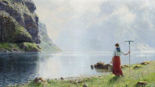 Woman with basket at a river bank