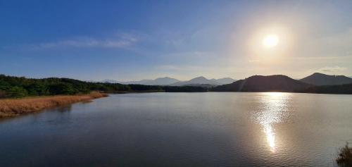 Sun is spread out through the water surface. Goseong, Gangwondo, South Korea.