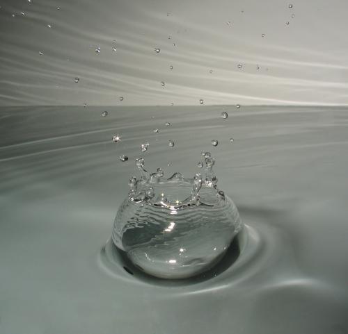 Macrophotograph of a drop of water hitting the surface