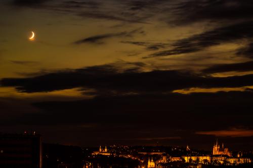 Moon over Prague at night