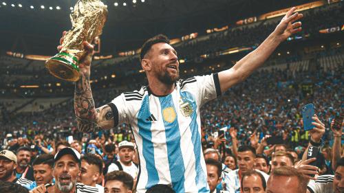 Lionel Messi lifiting the 2022 FIFA World Cup trophy