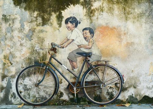 Sibling riding on a bycycle wallpaper wallpaper