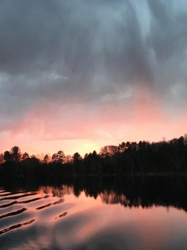 Light rain as the suns sets over the Lake.