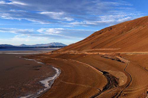 Train passing through the Salar de Carcote salt flat in Chile. Photo by Neel Bechtiger.