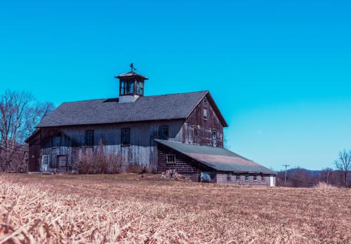 Abandoned barn in a dead field