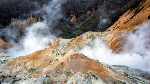 Sulphur clouds rising above Jigokudani  at dusk. Shikotsu-Tōya National Park, Hokkaido, Japan.