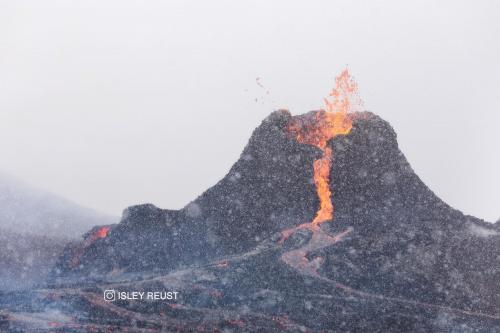 Blizzard during volcanic eruption in Iceland  IG: isleyreust