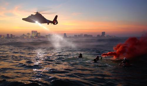 U. S. Coast Guard rescue swimmers train off the coast of Atlantic City, New Jersey, Sept. 18, 2006