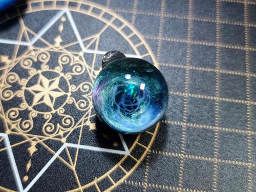 Made this galaxy pendant with resin, opal, pigment, acrylic, glitter