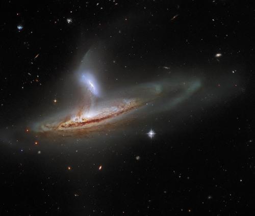 This image from the NASA/ESA Hubble Space Telescope feels incredibly three-dimensional for a piece of deep-space imagery. The image shows Arp 282, an interacting galaxy pair composed of the Seyfert galaxy NGC 169  and the galaxy IC 1559 .