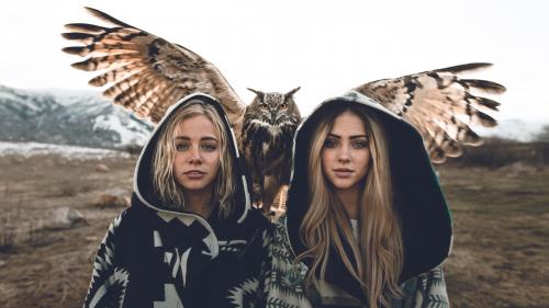 Two girls with an owl