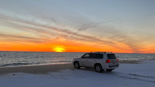 Doug Demuro's Toyota Land Cruiser on a sunset