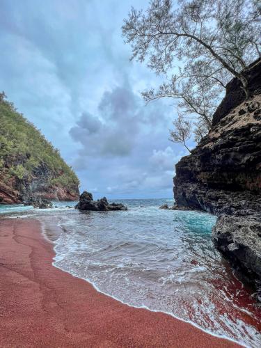 Naturally red sand of Kaihalulu Beach, Hawaii USA