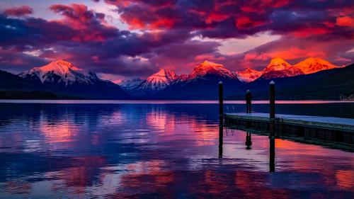 Dock Under Cloudy Sky in Front of Mountain