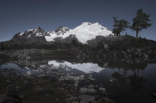 Mount Baker, Washington illuminated by the full moon on a beautiful summer night