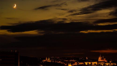 The Moon over Prague at night