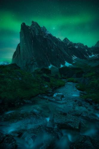 Northern Lights over one of the most spectacular mountains I've ever seen. Ragged Range, Northwest Territories