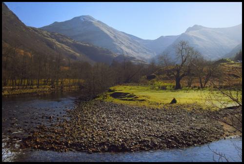 Sgùrr a' Mhàim and Stob Bàn from the meandering river in Glen Nevis: Lochaber, Scotland, UK