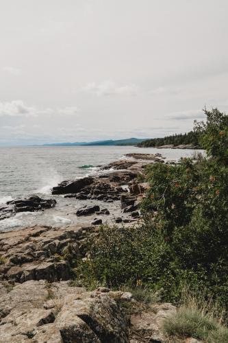 Looking South down the North Shore at the Lutsen mountains in the distance. Grand Marais, Minnesota.  OC.