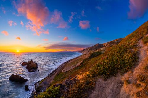 A rocky beach at sunset