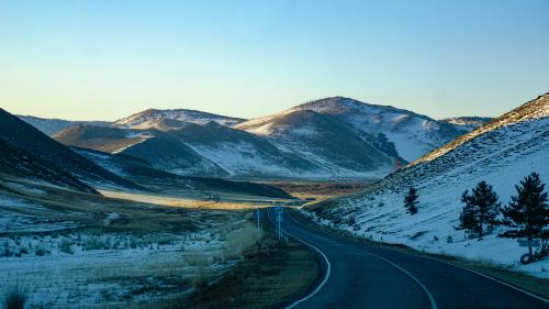 Gray Road Between Brown Mountains