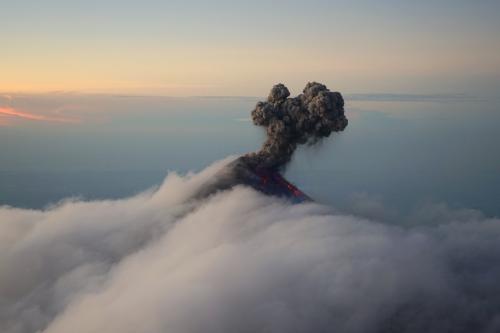 Volcan Fuego Erupting Above The Clouds - Guatemala