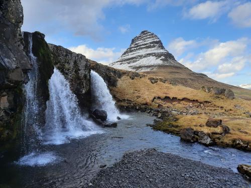Kirkjufell mountain and waterfall in Icelandic spring