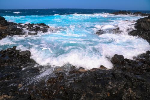 Waves rushing into the rocks in Caleta de Fuste, Fuerteventura