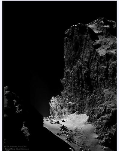 A 1-kilometer cliff on comet Churyumov-Gerasimenko taken by the Rosetta probe. The boulders on the ground are over 18 meters across