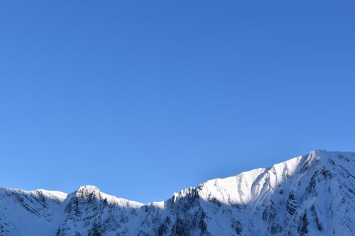 Sun hitting peaks in the Alps