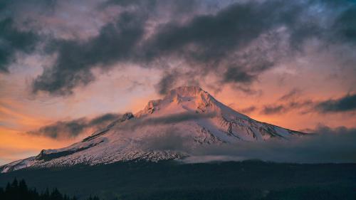 Snow Capped Mountain Under Gray Clouds