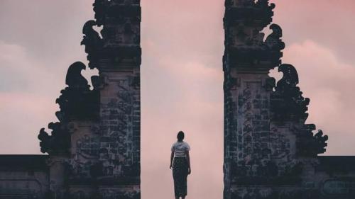 Photo of Person Standing on a Famous Temple