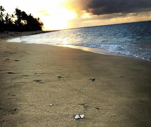 Sunset on a beach while on vacation in Hawaii