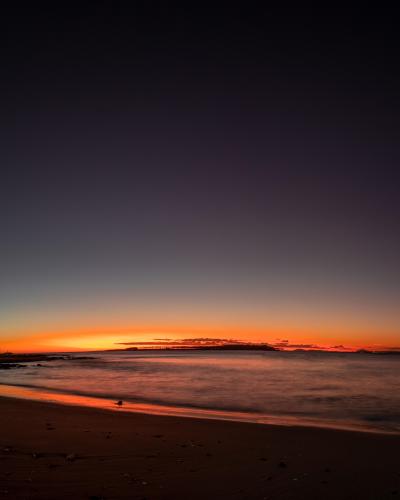 Super wide view of the sunset from Punta del Este Beach, Uruguay