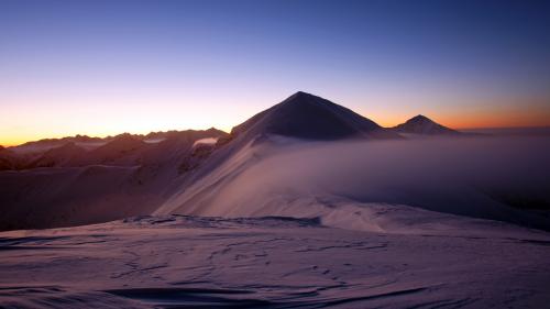 Sand dunes in a desert at sunrise