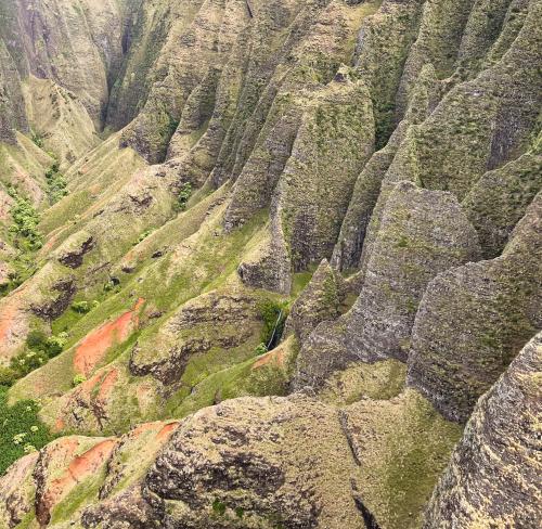 Napali cliffs from doorless helicopter, Kauai