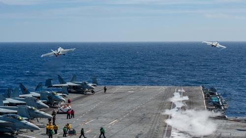 launch from the flight deck of the aircraft carrier USS Nimitz .