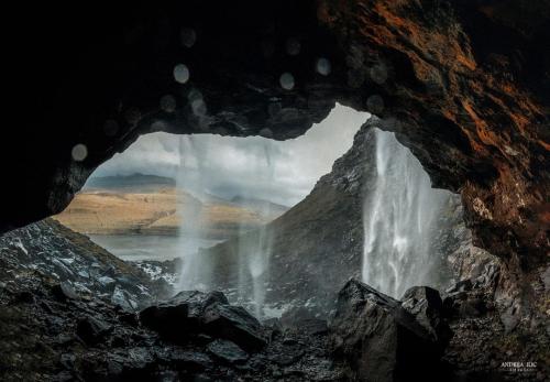 Behind a waterfall, Faroe Islandss  IG @andrija_ilic_images