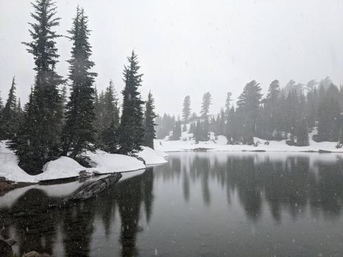 Emerald Lake in Lassen Volcanic National Park during a huge and unusual mid-June snowstorm, CA