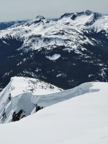 Huge cornices overhanging the south ridge of Nak Peak, BC, Canada.