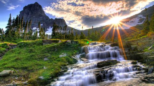 Sunrise over a Mountain Waterfall