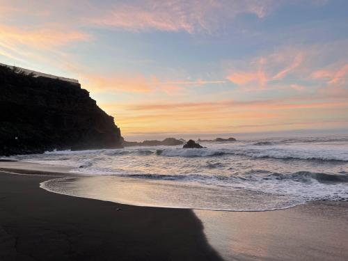 Sunset at black sand beach, Canary Islands