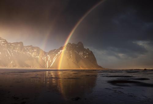 Sunset rainbow at Stoksness, Iceland