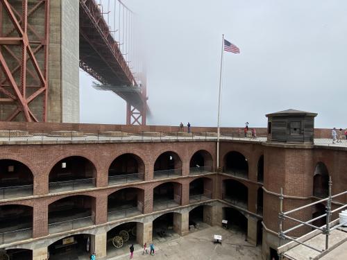 Fort Point under a foggy Golden Gate Bridge, San Francisco