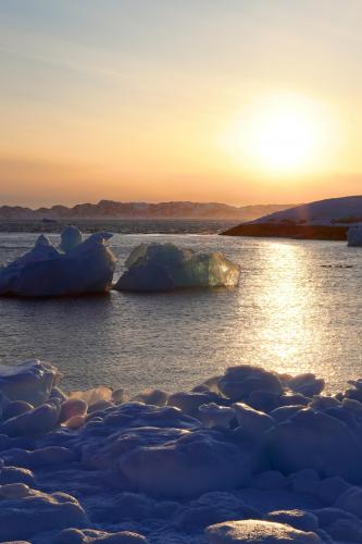 Light through ice during sunset in Nuuk, Greenland